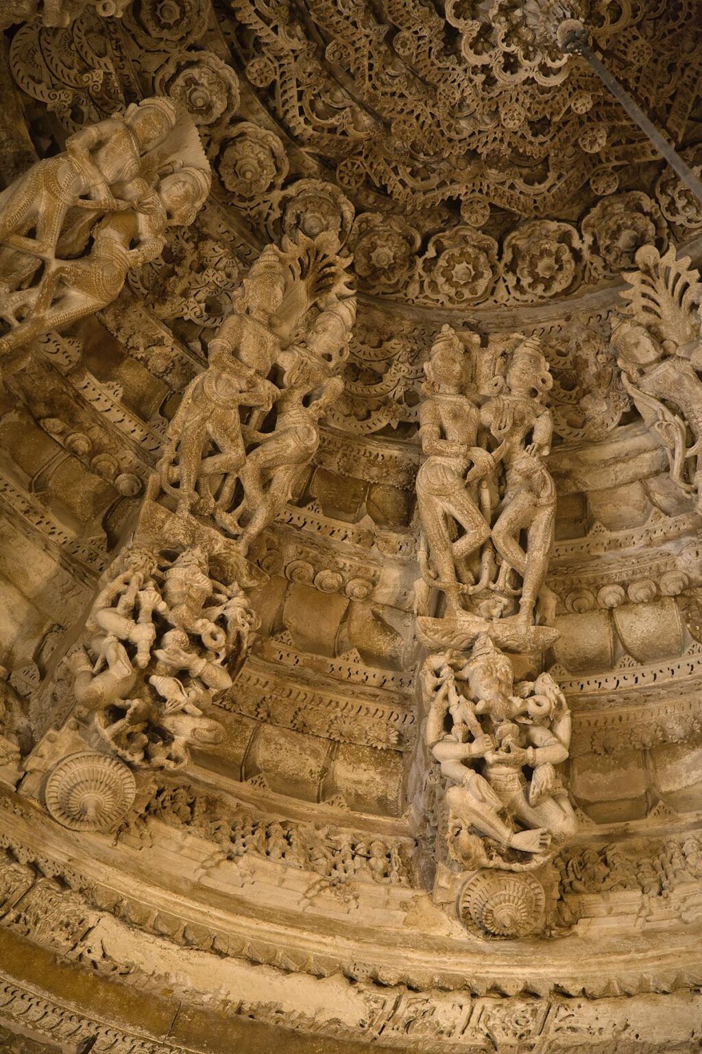 The hand carved sandstone DOME CEILING of the CHANDRAPRABHU JAIN TEMPLE displays carved deities inside JAISALMER FORT - RAJASTHAN, INDIA
