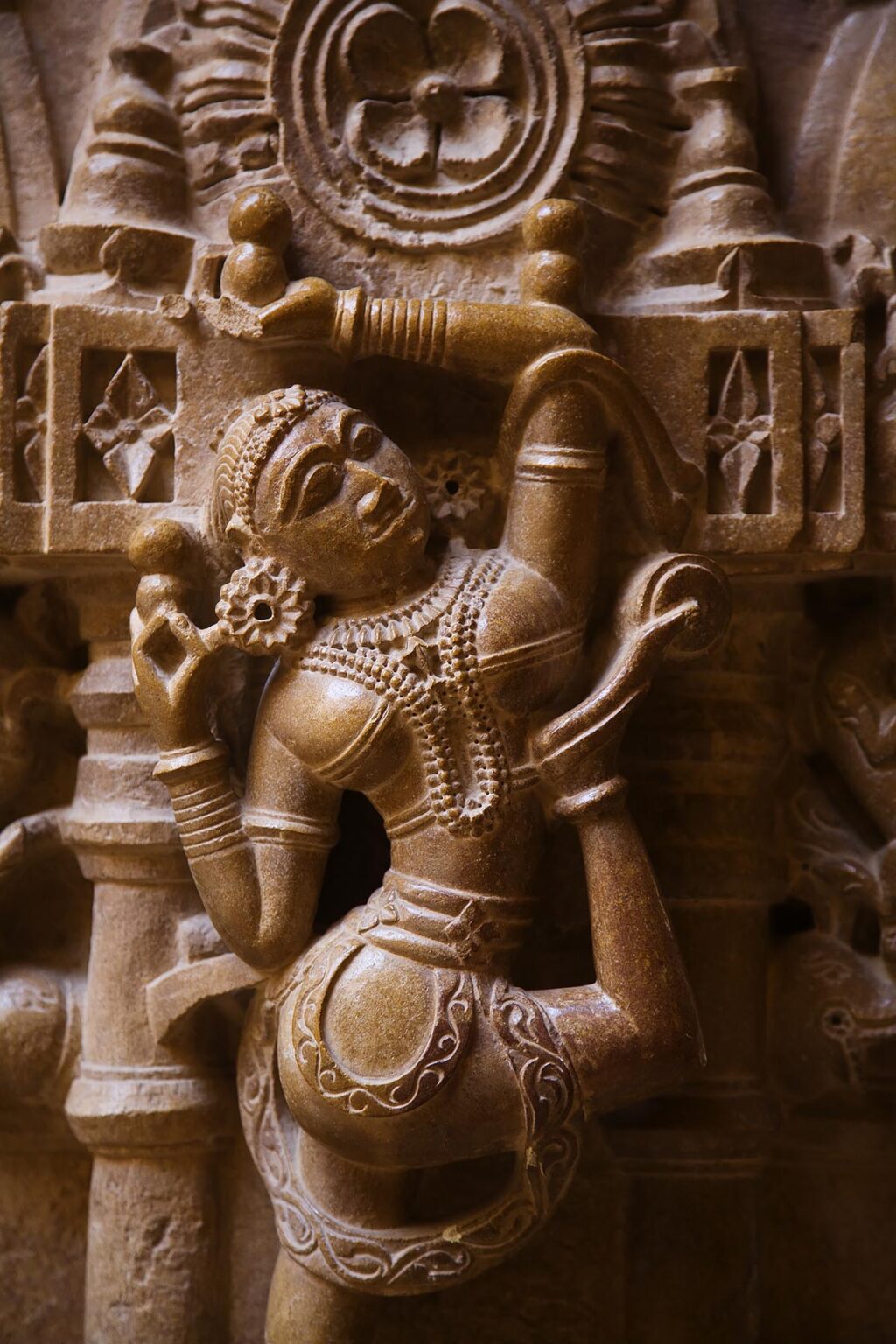 A hand carved SANDSTONE FEMALE ANGEL in the CHANDRAPRABHU JAIN TEMPLE inside JAISALMER FORT - RAJASTHAN, INDIA