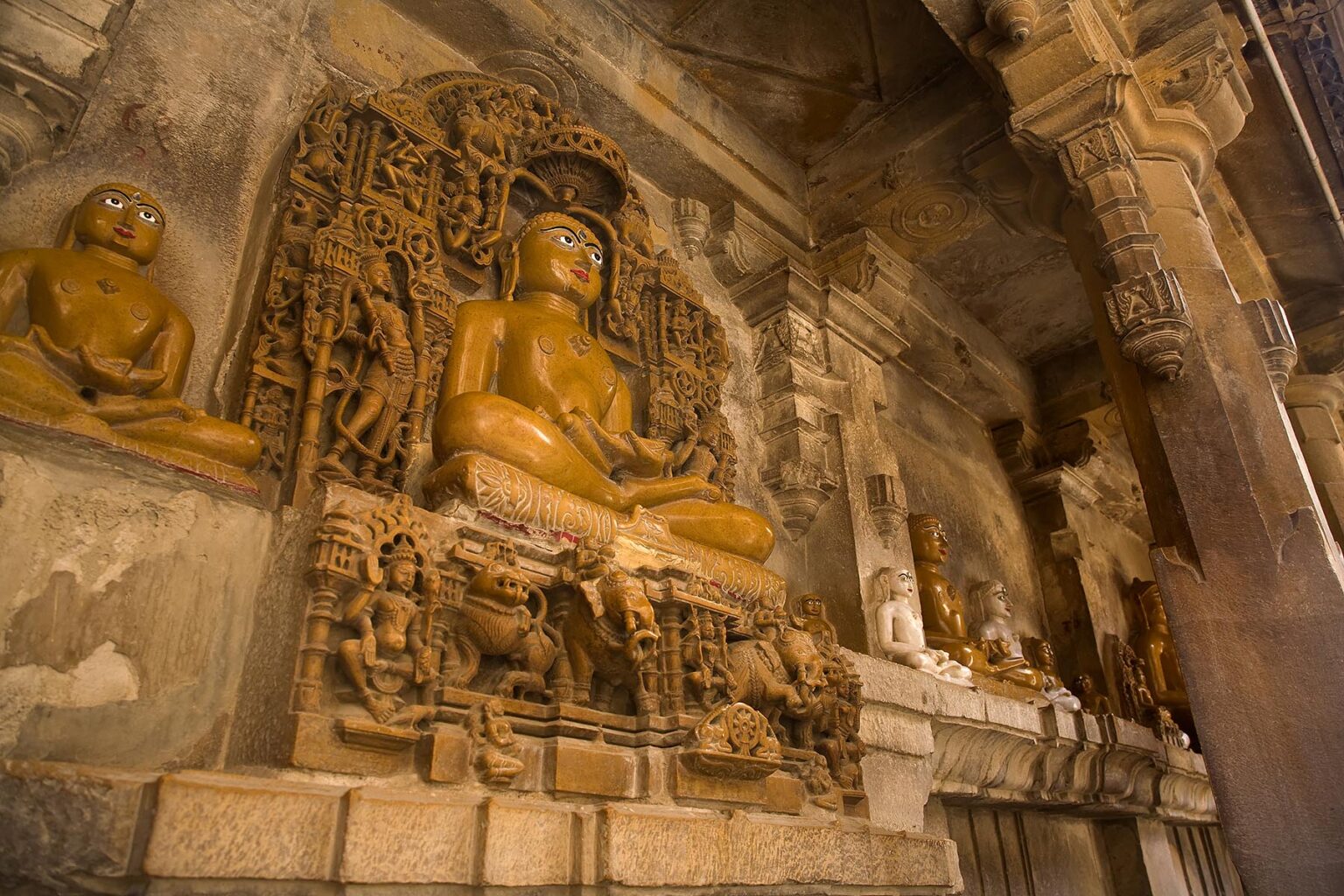 Hand carved SANDSTONE statues of MAHARIVA and other "Buddhas" in the  CHANDRAPRABHU JAIN TEMPLE inside JAISALMER FORT - RAJASTHAN, INDIA