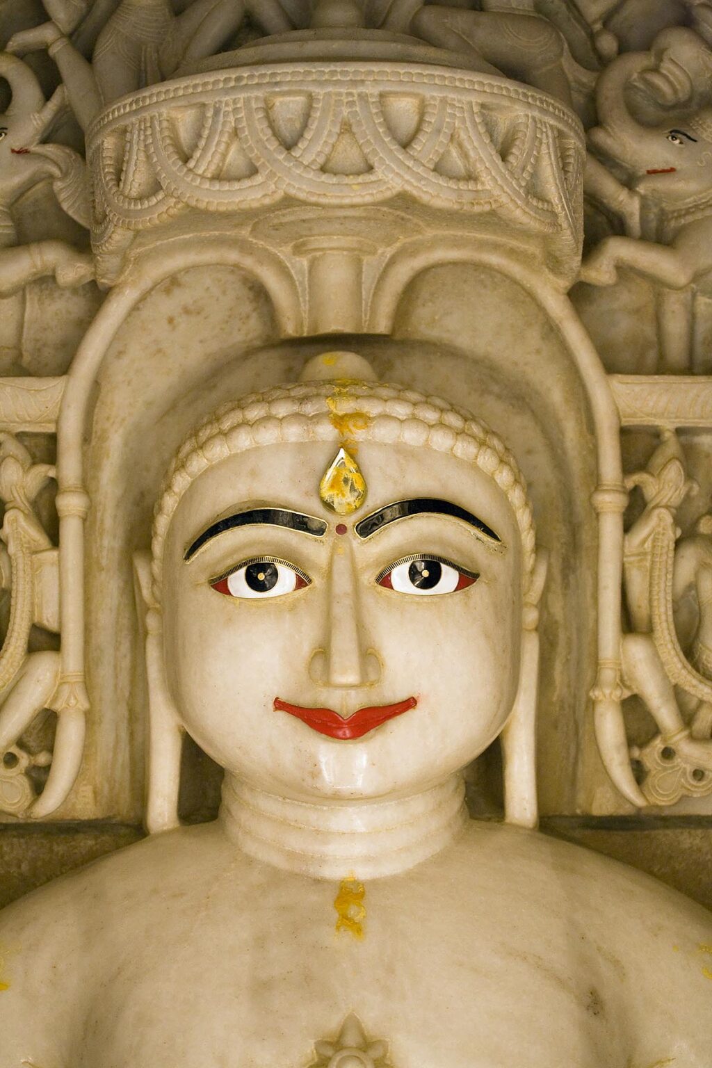 A hand carved WHITE MARBLE statue of MAHAVIRA in a JAIN TEMPLE inside JAISALMER FORT - RAJASTHAN, INDIA