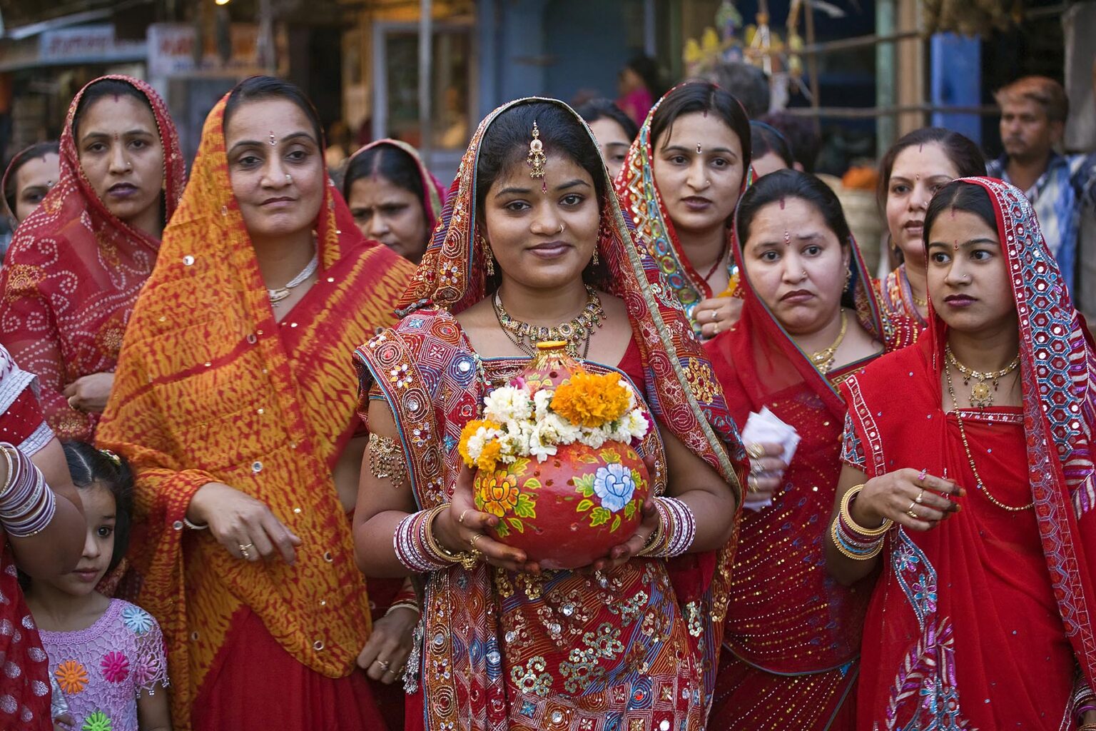 Rajasthani women carry a clay pot through the city as part of the GANGUR FESTIVAL in JOHDPUR - RAJASTHAN, INDIA