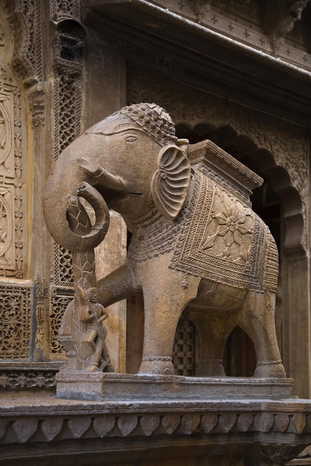 A hand carved SANDSTONE ELEPHANT decorates the exterior of the Mayors beautiful HAVELI or home in JAISALMER - RAJASTHAN, INDIA