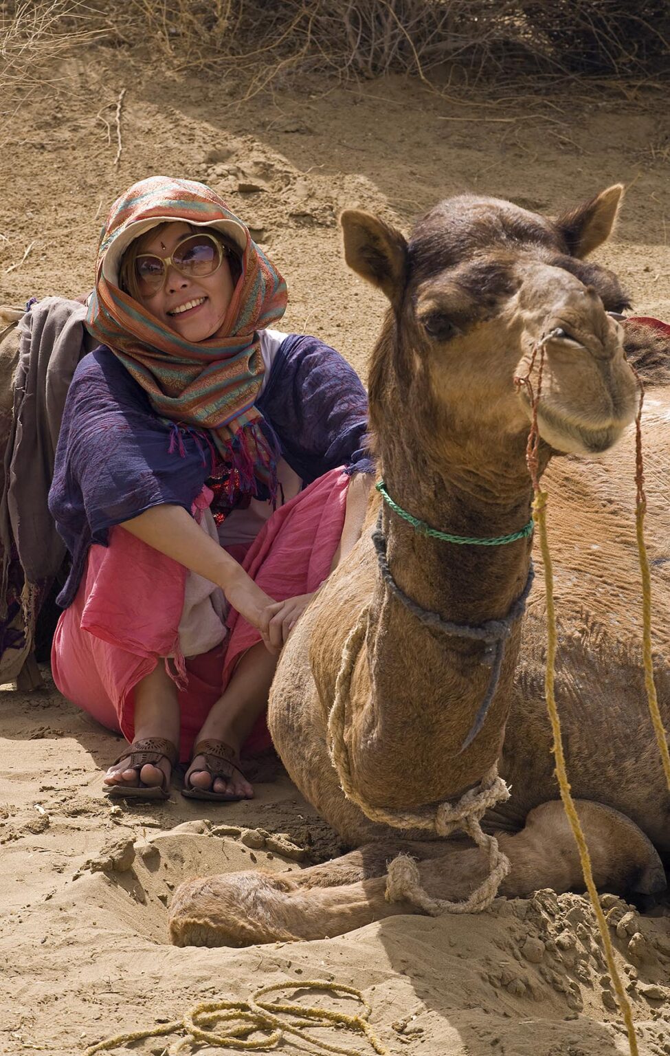 Japanese tourist on CAMEL SAFARI in the THAR DESERT near JAISALMER - RAJASTHAN, INDIA -MR