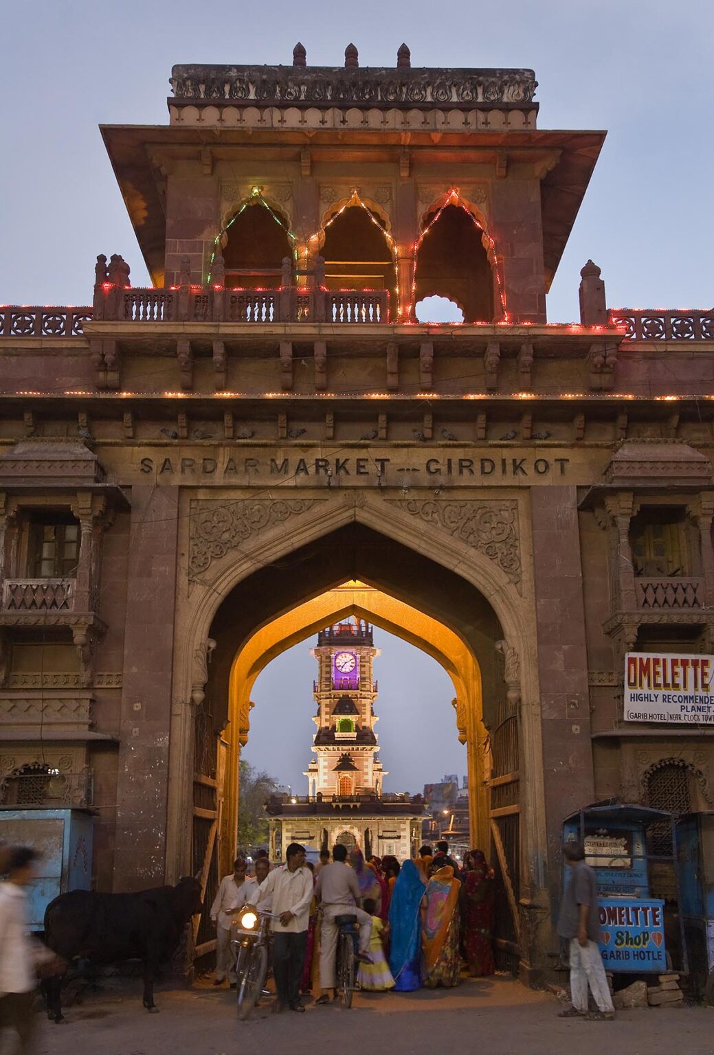 Dusk at the main gate to SARDAR  MARKET CIRDIKOT in JOHDPUR also known as the BLUE CITY - RAJASTHAN, INDIA