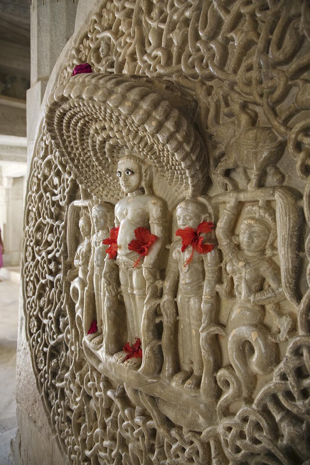 Carved CELESTIAL DEITIES protected by108 COBRAS inside the CHAUMUKHA MANDIR TEMPLE at RANAKPUR in the Pali District of RAJASTHAN near Sadri - INDIA
