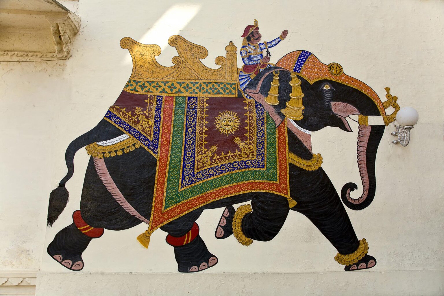 A painting of an ELEPHANT and RIDER of the wall of the CITY PALACE of UDAIPUR - RAJASTHAN, INDIA