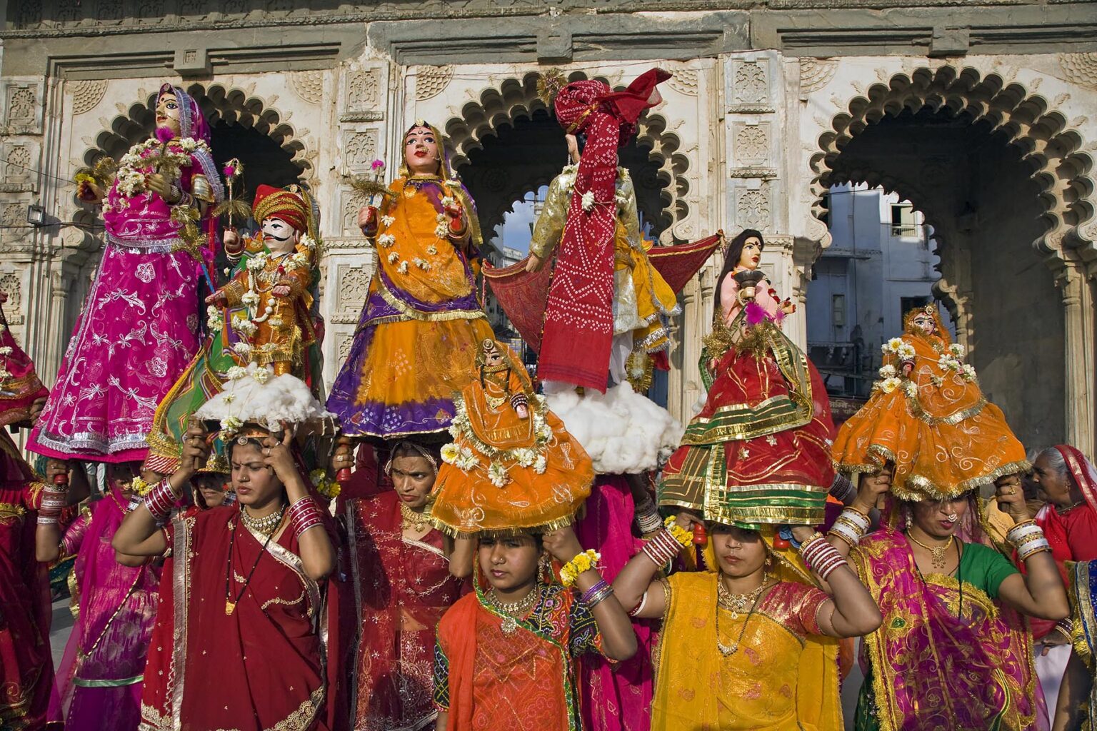 Rajasthani women carry effigies of Shiva and his wife Parvati at the GANGUR FESTIVAL also known as the MEWAR FESTIVAL in UDAIPUR - RAJASTHAN, INDIA