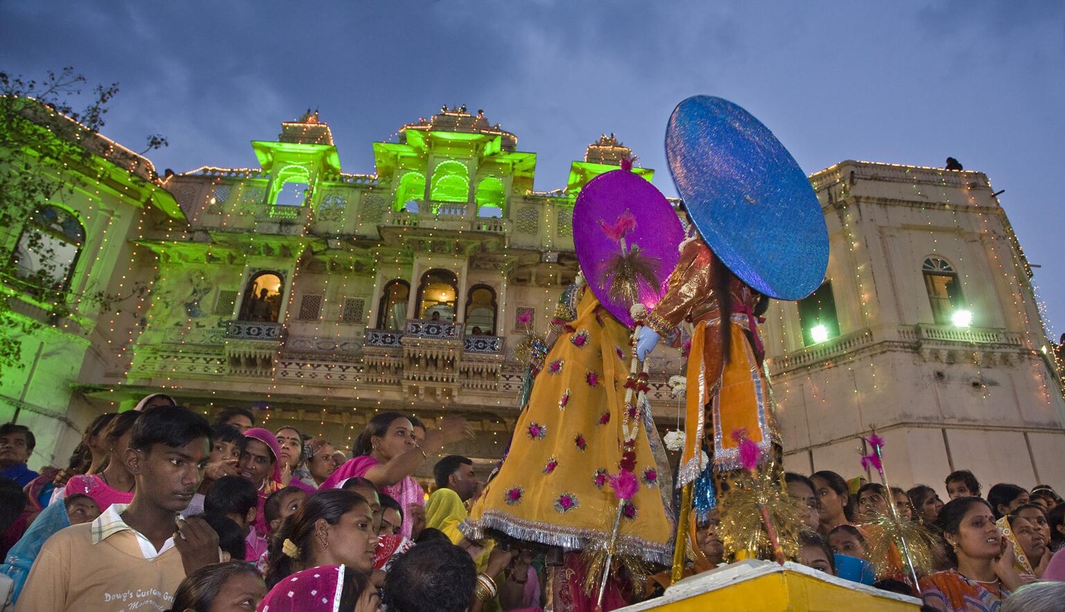 Rajasthani women carry effigies of Shiva and his wife Parvati at the GANGUR FESTIVAL also known as the MEWAR FESTIVAL in UDAIPUR - RAJASTHAN, INDIA