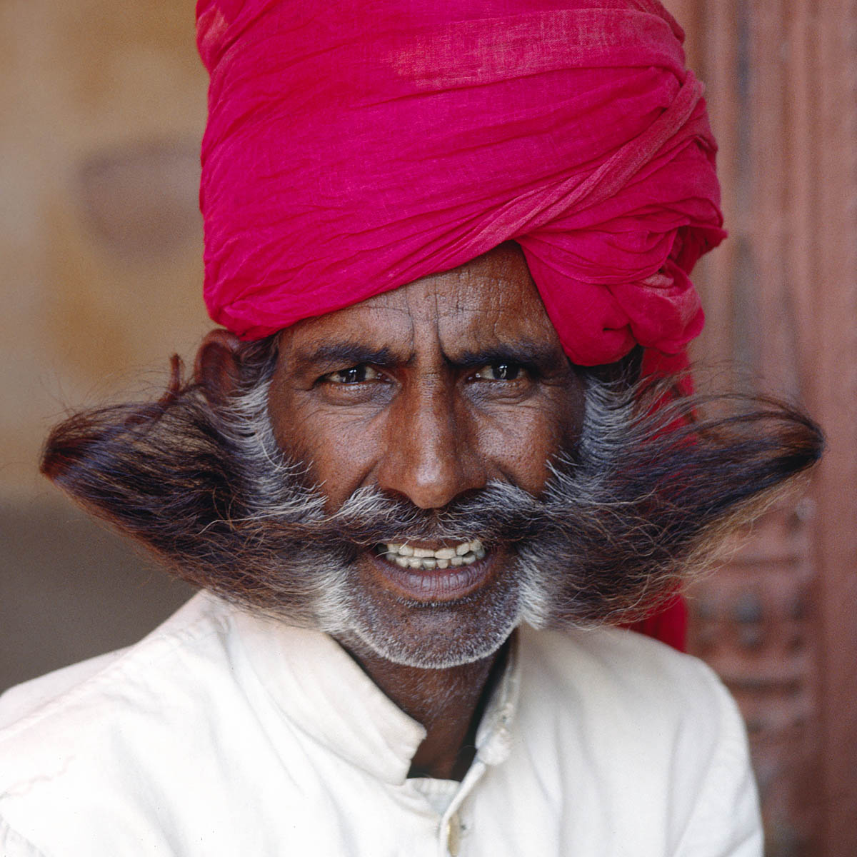 GUARD with RED TURBAN and "soup-strainer" MUSTACHE and BEARD at the CITY PALACE in JAIPUR - RAJASTHAN, INDIA