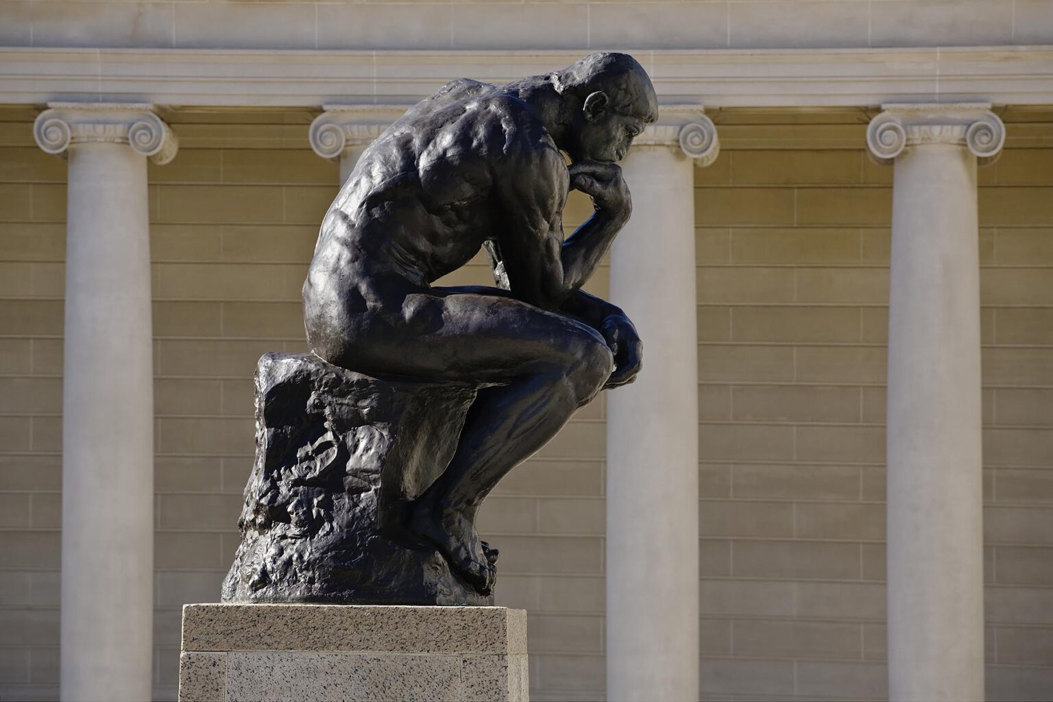 The courtyard of the LEGION OF HONOR with an Auguste Rodin sculpture titled THE THINKER - SAN FRANCISCO, CALIFORNIA