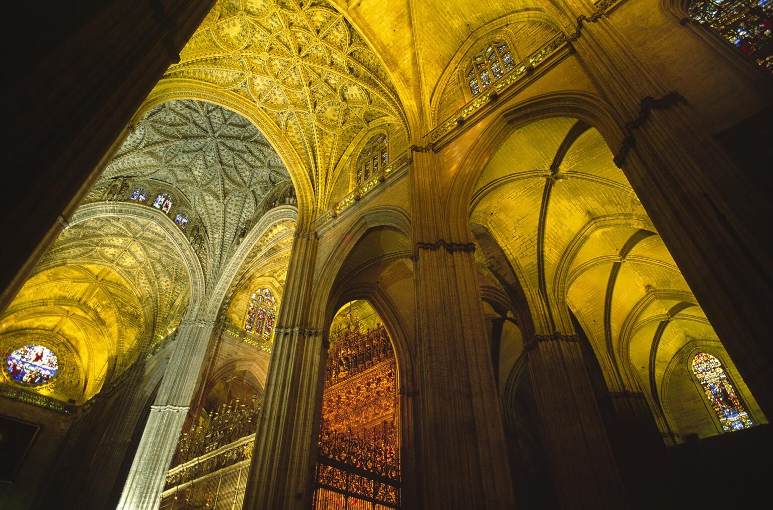 INTERIOR of SEVILLA'S CATHEDRAL, the worlds largest GOTHIC CHURCH started in 1401 AD - SPAIN