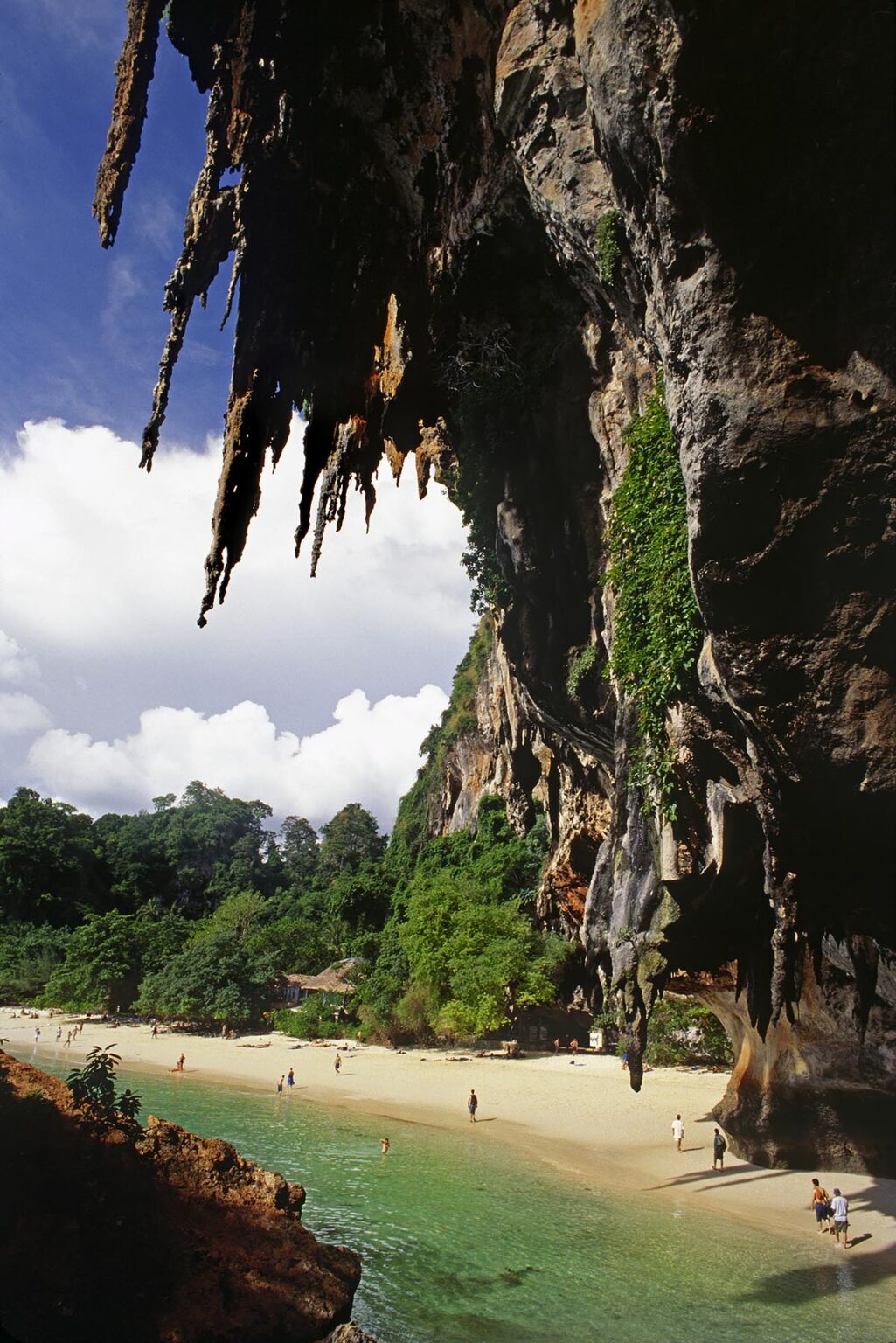 Clear tropical waters and LIMESTONE CLIFFS as seen from inside a CAVE in the beach resort of KRABI - THAILAND