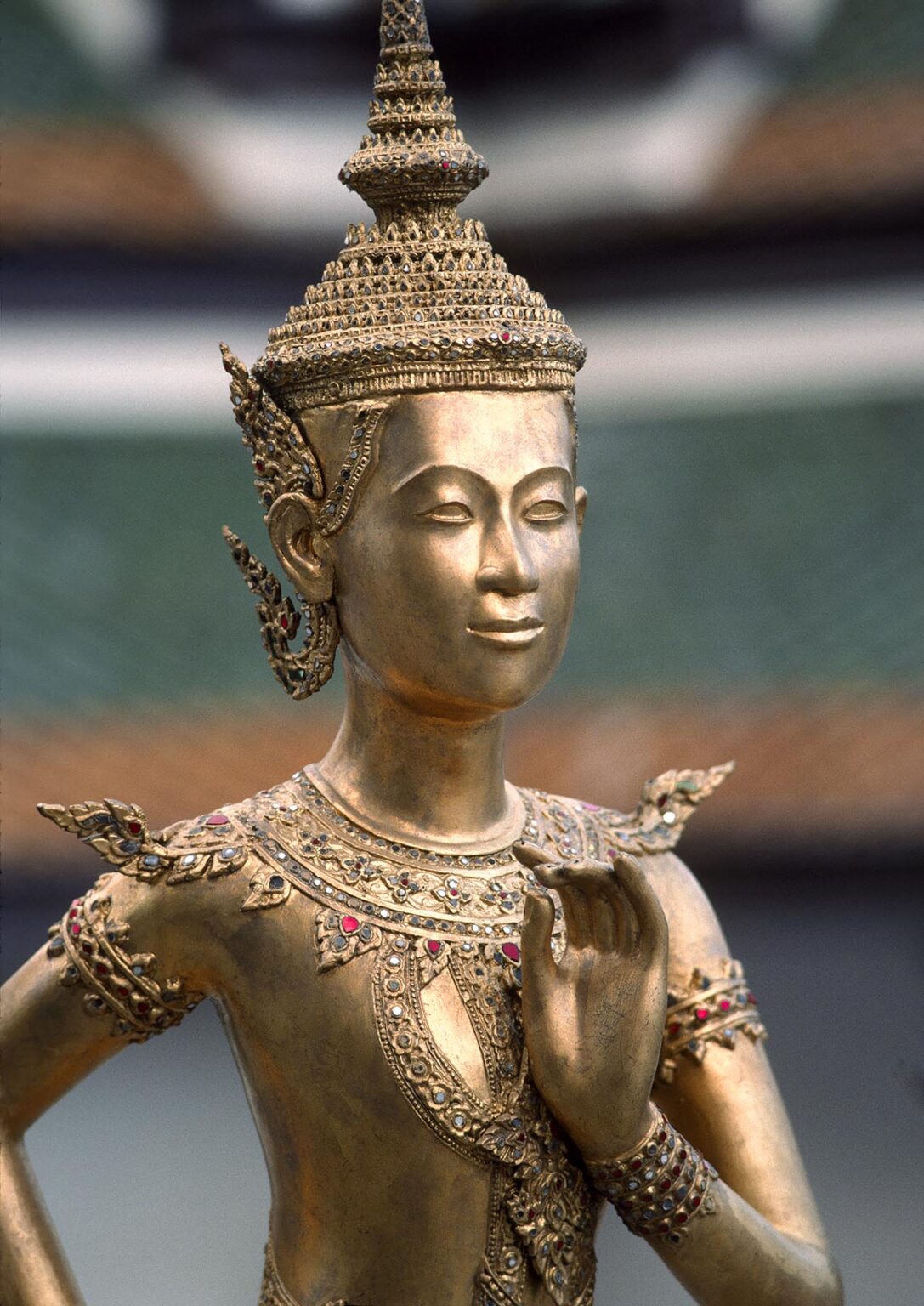 Statue of a BUDDHIST GODDESS at WAT PHRA KEO which is part of the GRAND PALACE complex - BANGKOK, THAILAND