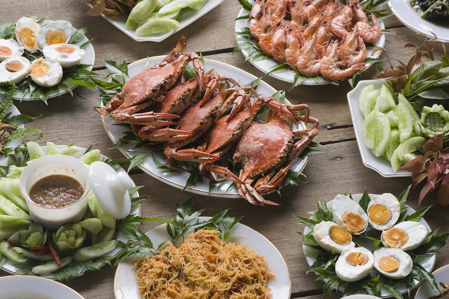 A feast of locally harvested crab, shrimp, wild and domestic vegetable are prepared for visitors in  Tung Nang Dam located on the North Andaman Sea - THAILAND