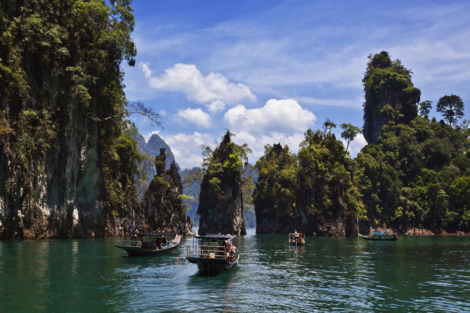 KARST FORMATIONS covered with tropical jungle at CHEOW EN LAKE in the KHAO SOK NATIONAL PARK - THAILAND