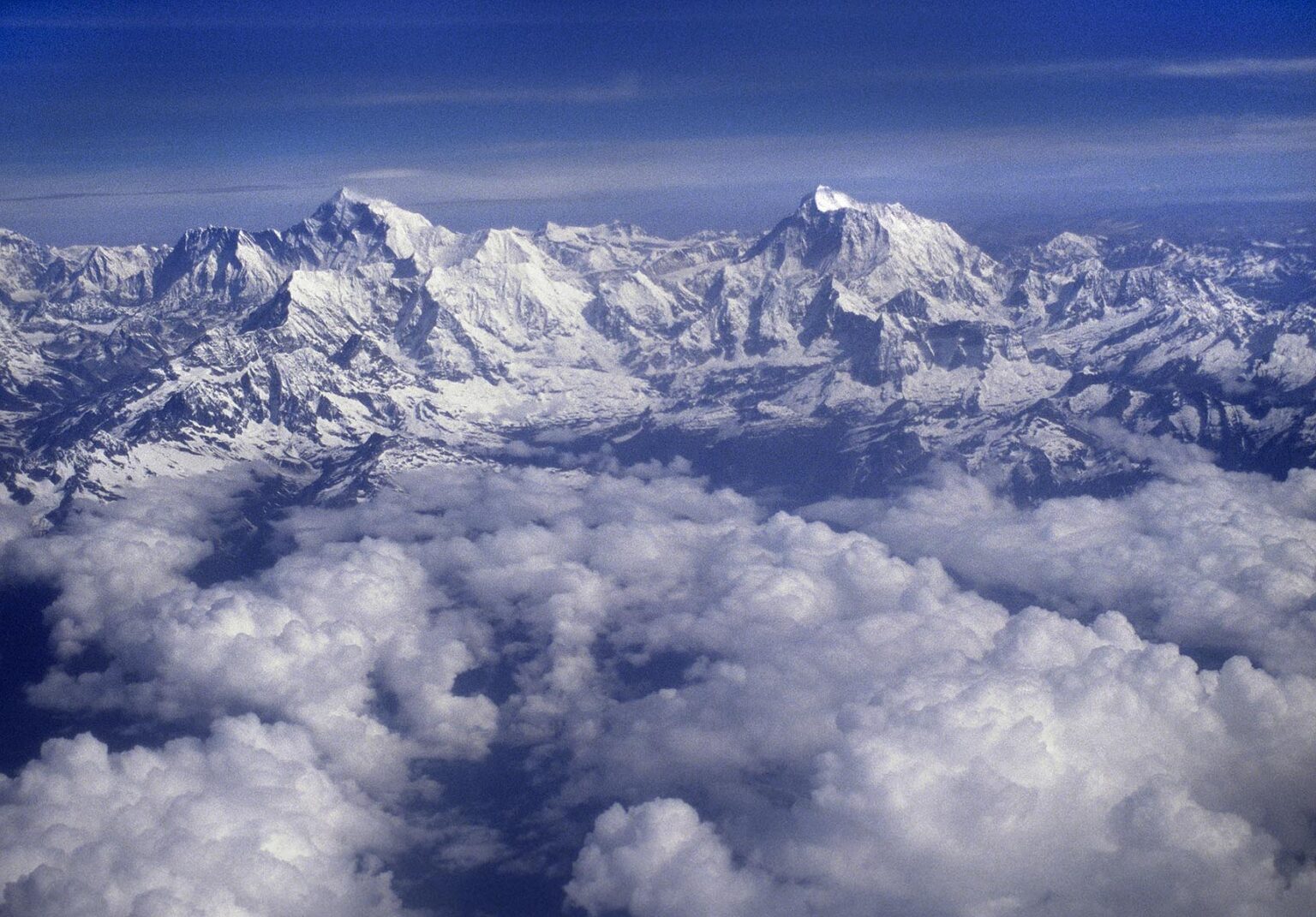 ARIAL view of the HIMALAYAS covered in snow - flight between KATMANDU, NEPAL & LHASA, TIBET