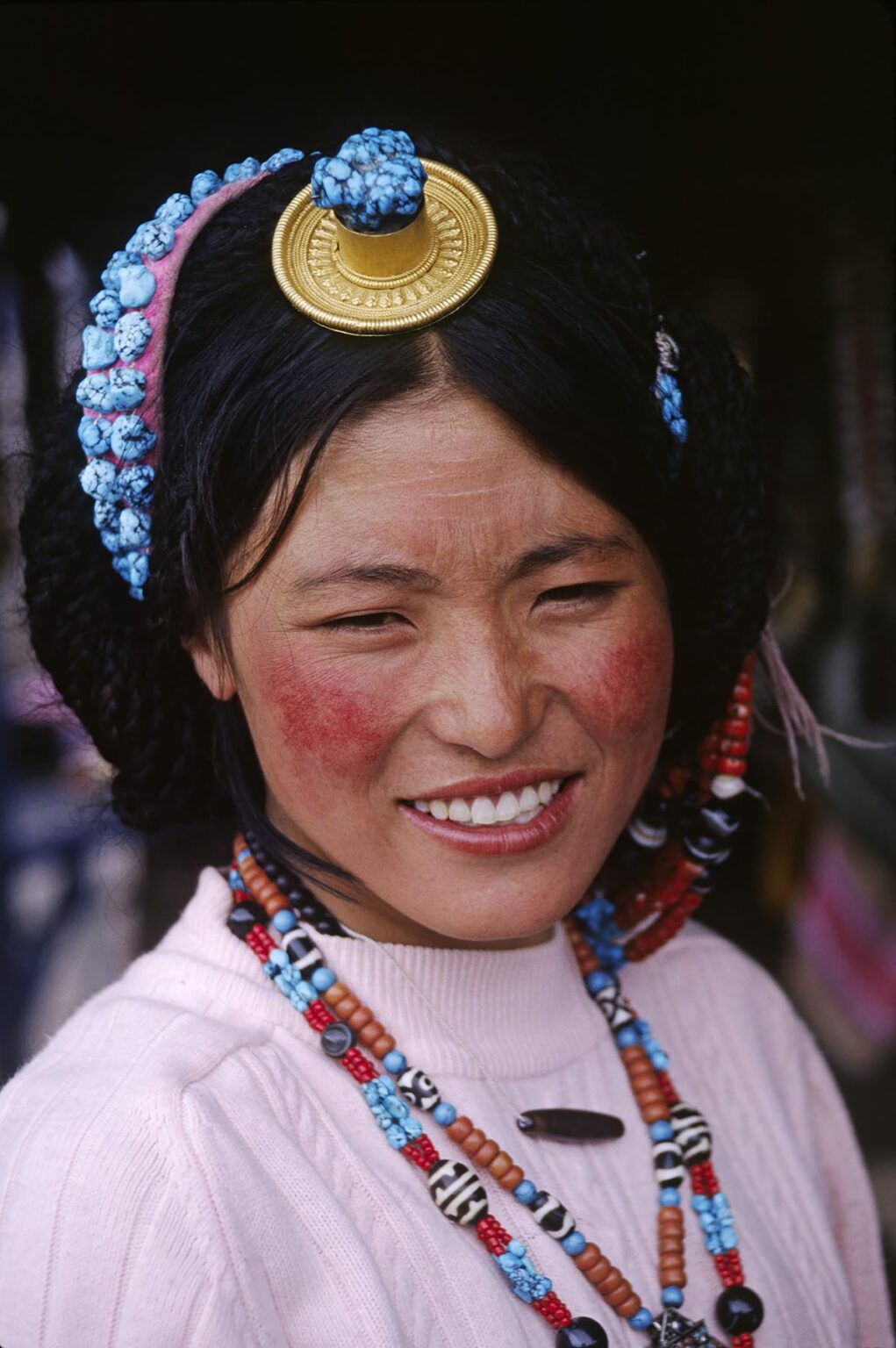 A TIBETAN BEAUTY wears TURQUOISE, CORAL, Z-STONES & A GOLD & CORAL HAIR PIECE - LHASA, TIBET