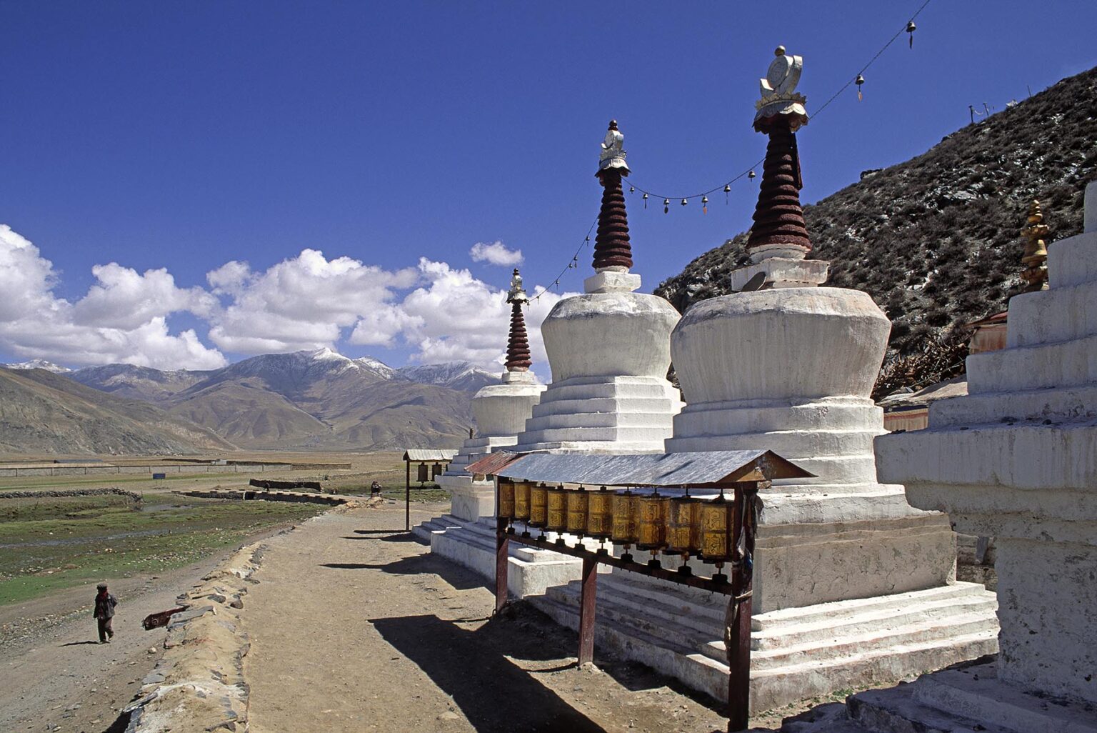 STUPAS and PRAYER WHEELS outside KATSEL TEMPLE a Demoness subduing Temple built by Songtsen Gampo - CENTRAL TIBET