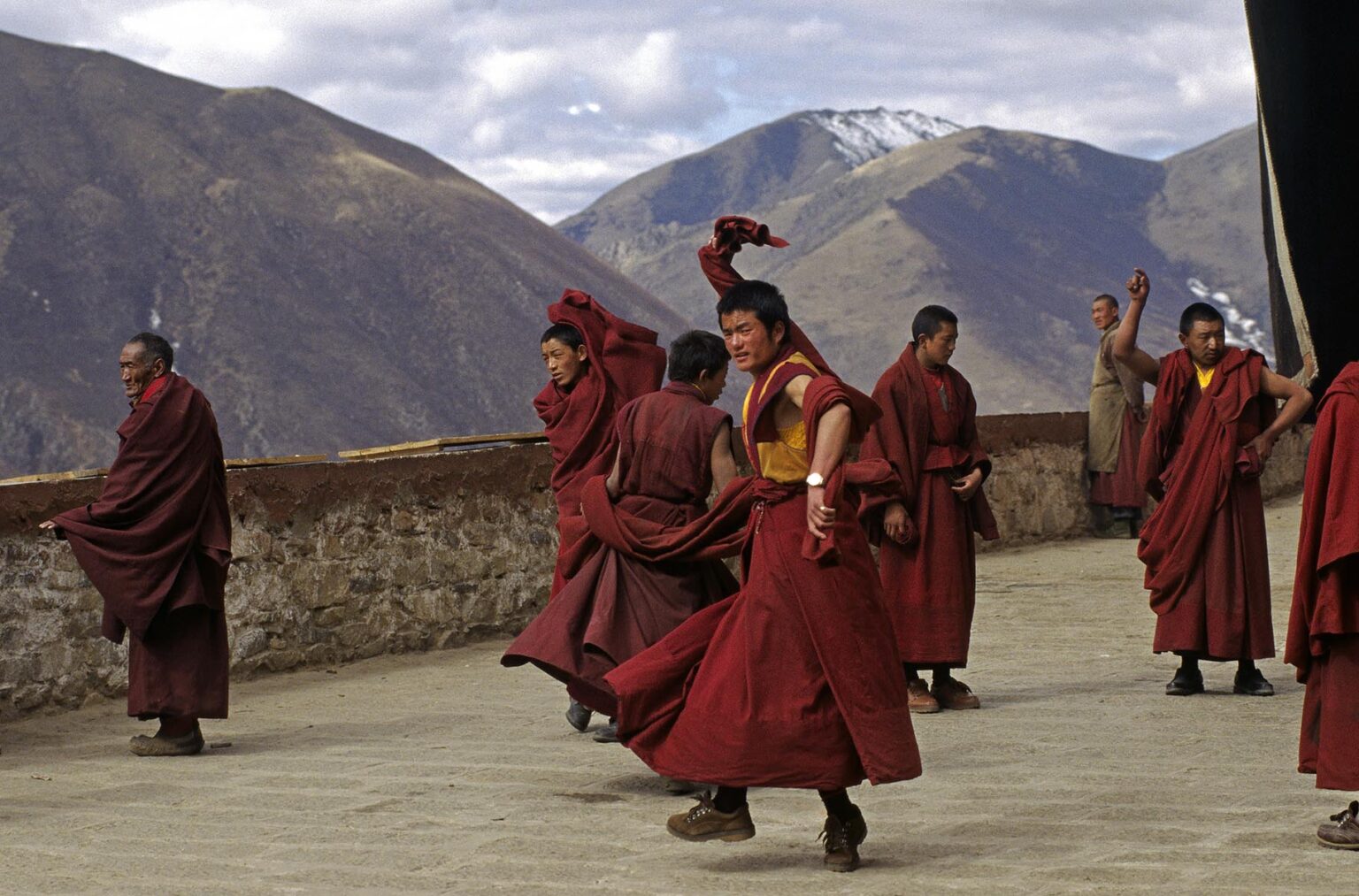 MONKS of the KAGYU SECT of TIBETAN BUDDHISM practice their ceremonial dances at DRIGUNG MONASTERY - TIBET