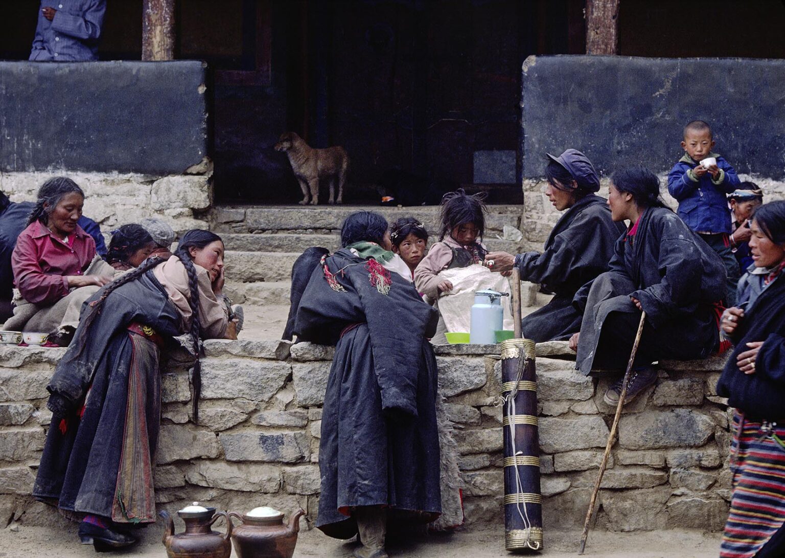 Tibetan pilgrims have lunch in Sera Monastery courtyard - Lhasa Tibet
