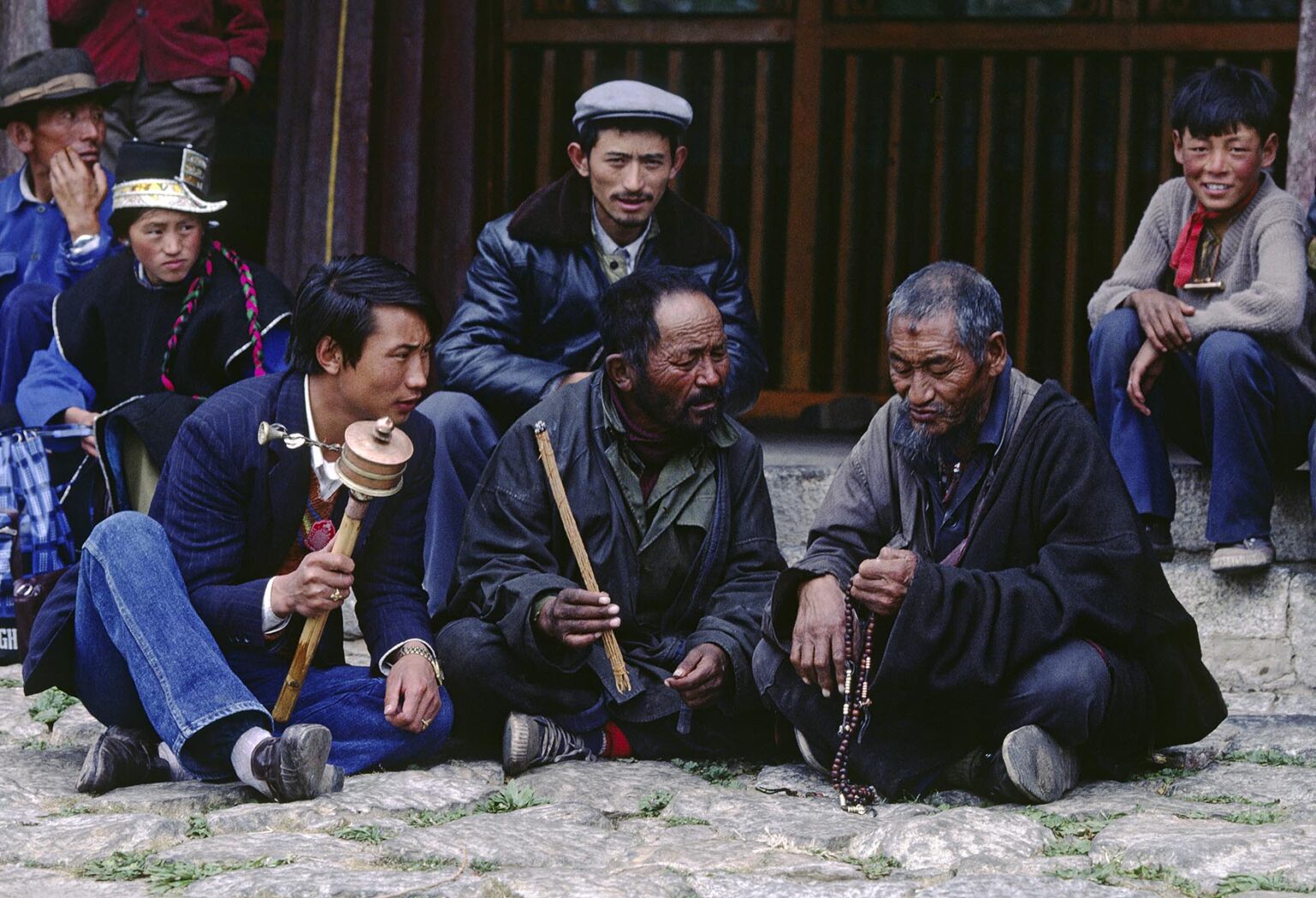 Pilgrims discuss the dharma at Sera Monastery - Lhasa, Tibet