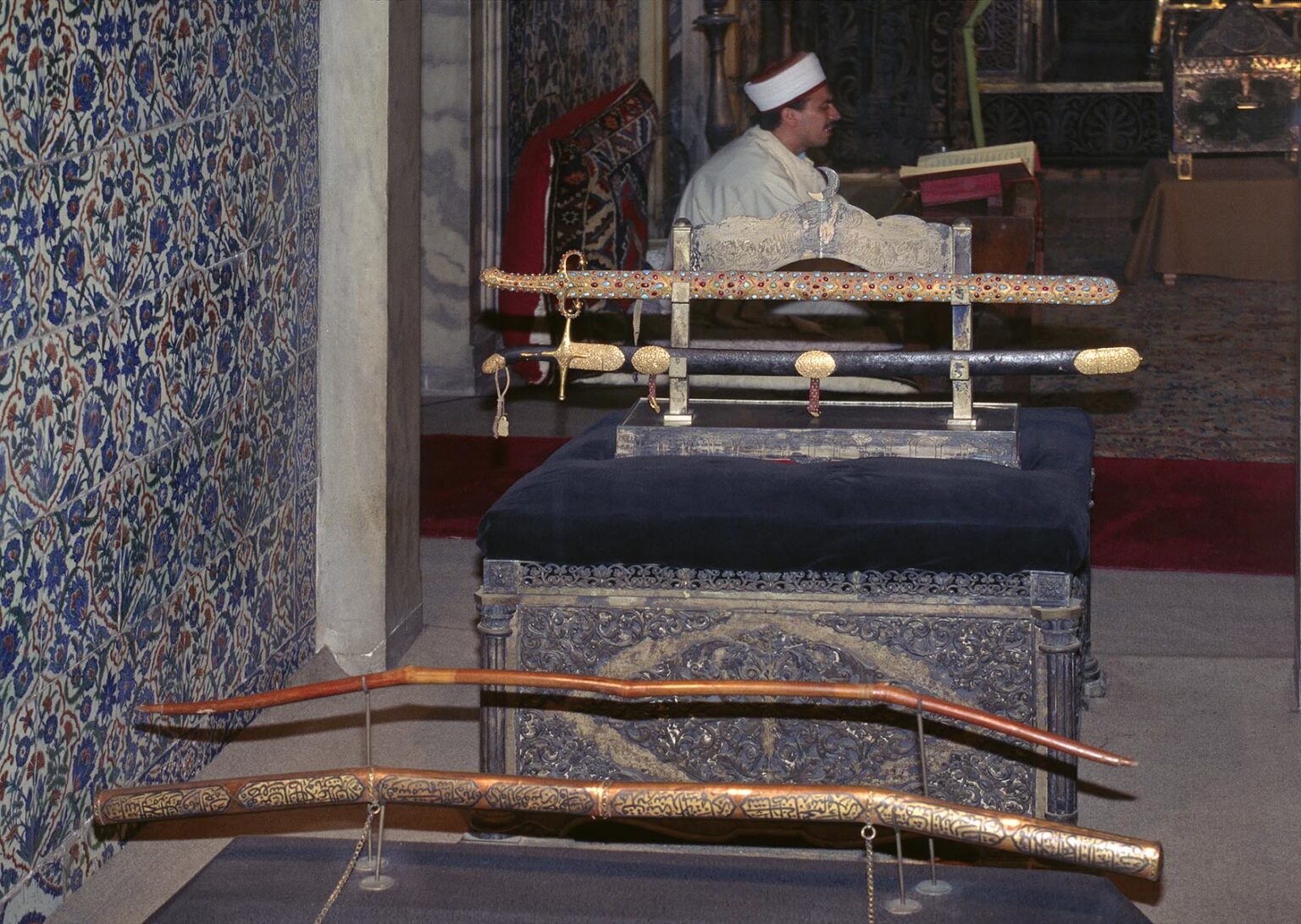 Swords and bow of the Sultan with singing holy man - Topkapi Palace Museum, Istanbul, Turkey