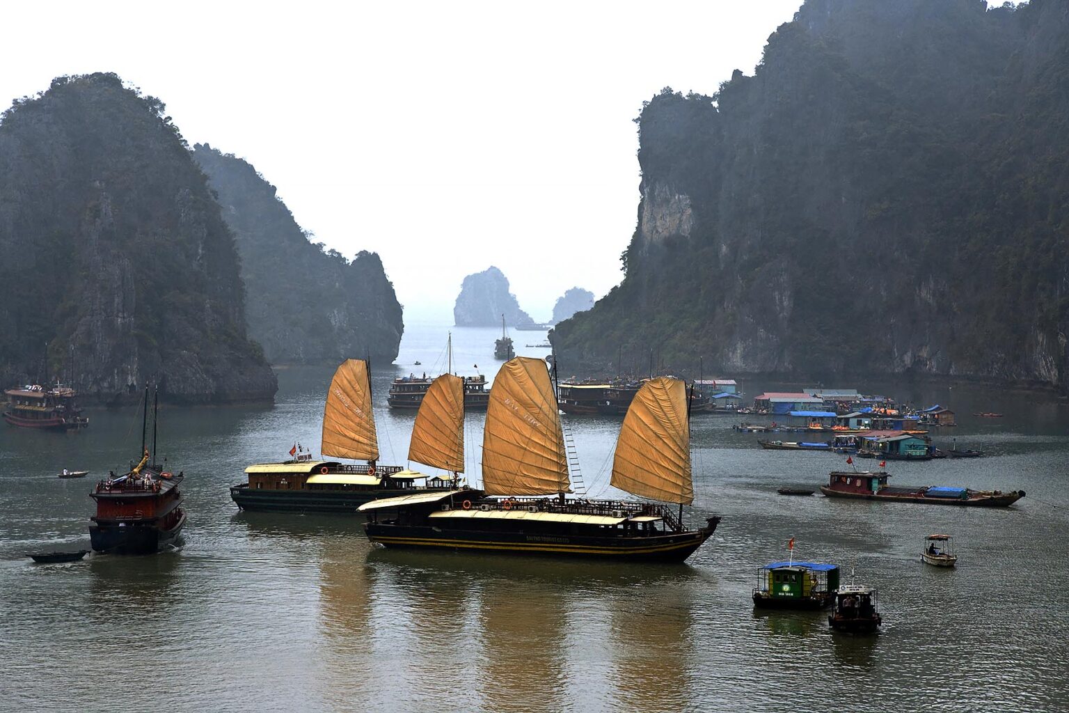 HANDCRAFTED JUNKS at anchor in THIEN CUNG HARBOR - HALONG BAY, VIETNAM