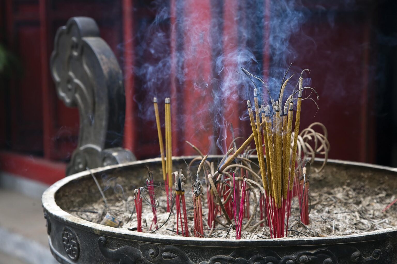 Incense burns outside the NGOC SON Temple in the old quarter - HANOI, VIETNAM