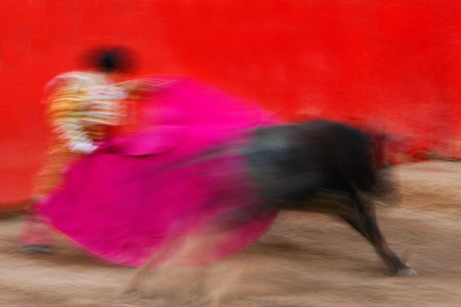 A MATADOR and bull are poetry in motion during a bull fight in the Plaza de Toros - SAN MIGUEL DE ALLENDE, MEXICO