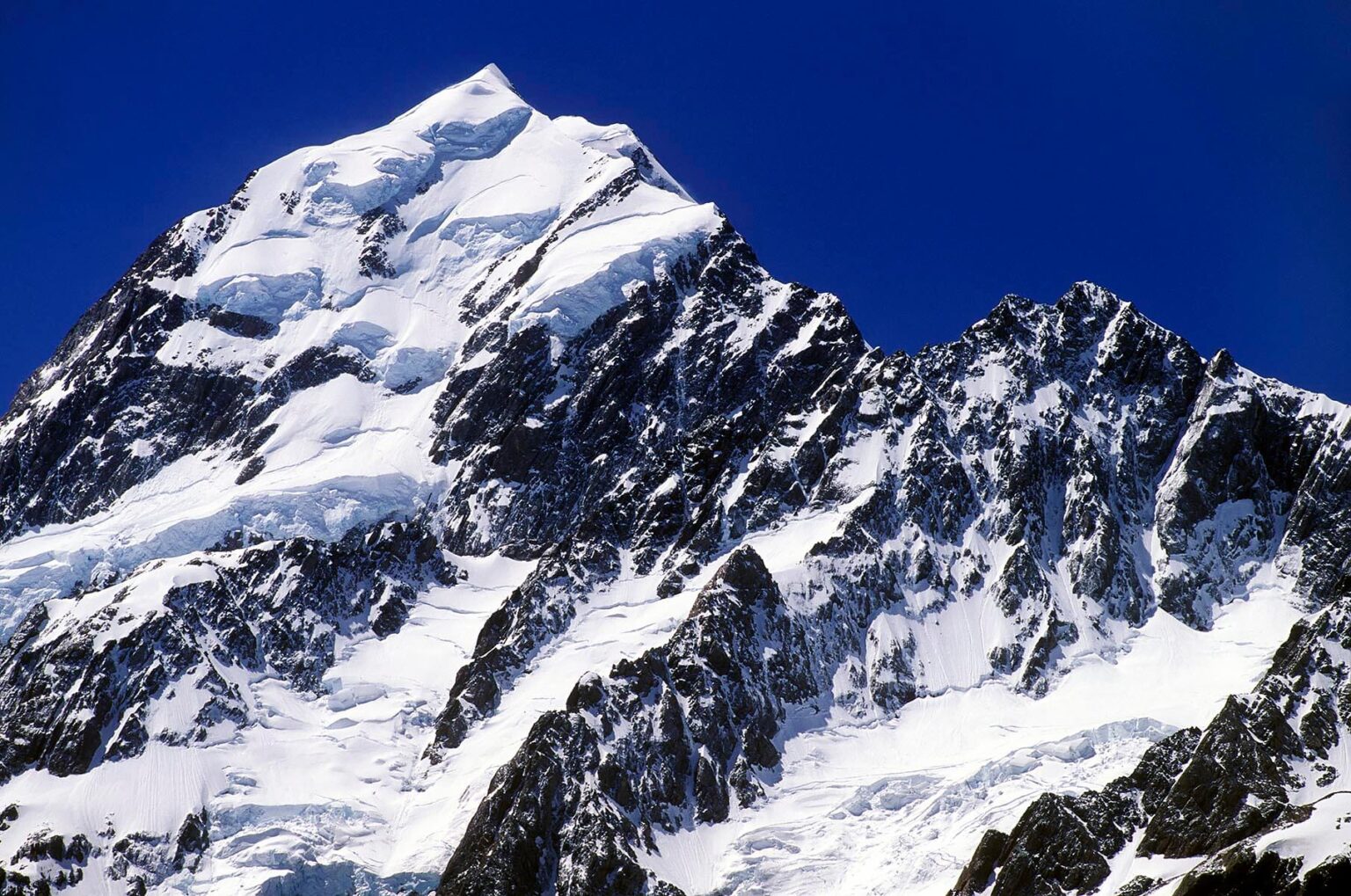 MT COOK, New Zealand's highest peak at 12,246 feet, is the crowning glory of the SOUTHERN ALPS - MT COOK NP