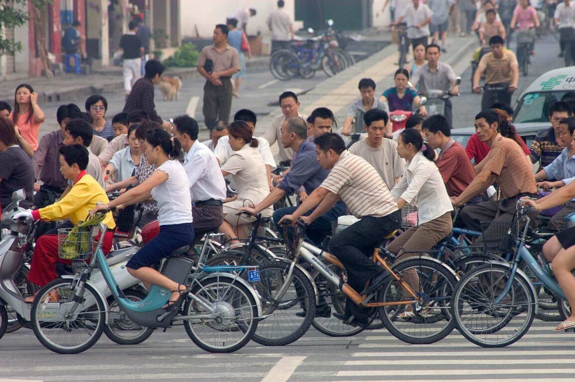 Bicycles are still a main form of transportation as seen here during rush hour - Chengdu, China in Sichuan Province