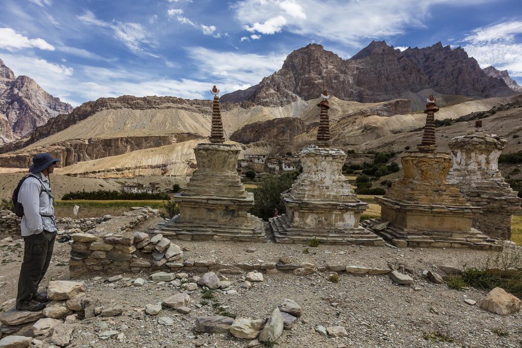 TODD LOVELL and BUDDHIST CHORTENS near NYERAK VILLAGE in the ZANSKAR RIVER GORGE - ZANSKAR, LADAKH, INDI