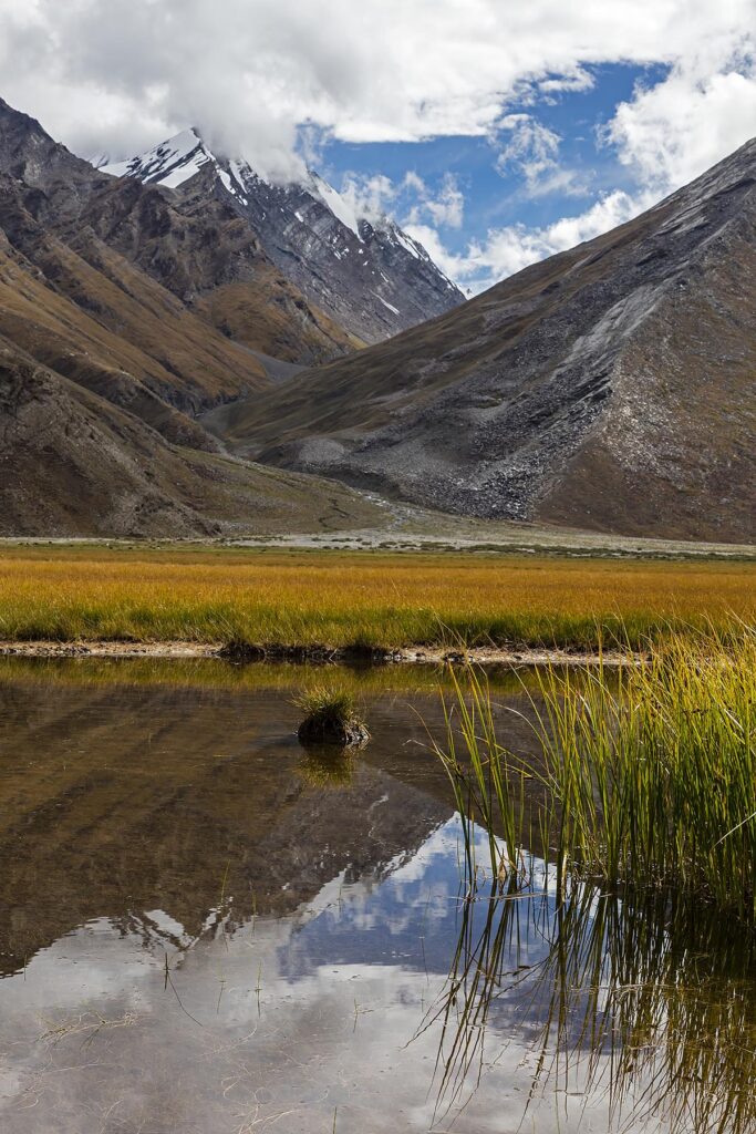 A pond reflect HImalayan peaks in the Suru River Valley - ZANSKAR, LADAKH, INDIA