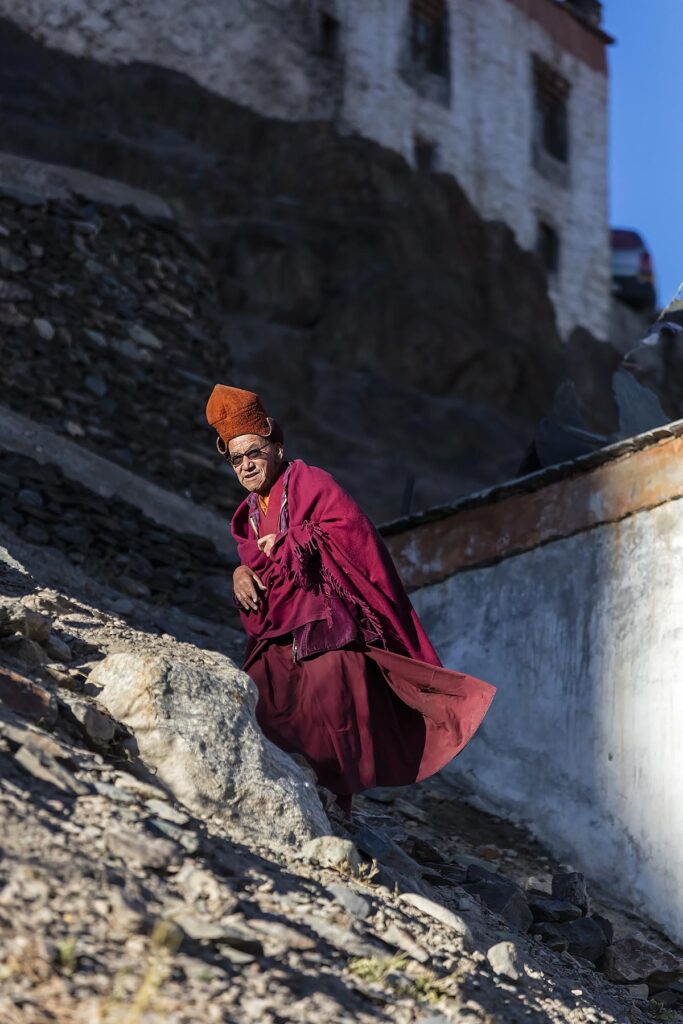 A BUDDHIST MONK at KARSHA GOMPA the largest Buddhist Monastery in the STOD RIVER VALLEY - ZANSKAR, LADAKH, INDIA