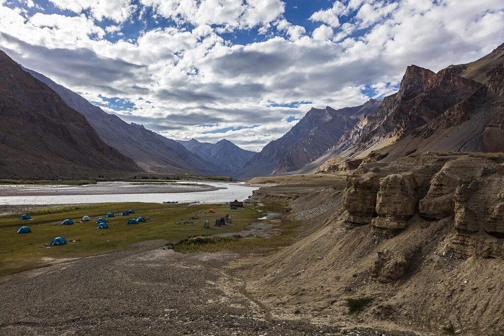 A spectacular campsite in the remote ZANSKAR RIVER GORGE is accessed by raft - ZANSKAR, LADAKH, INDIA