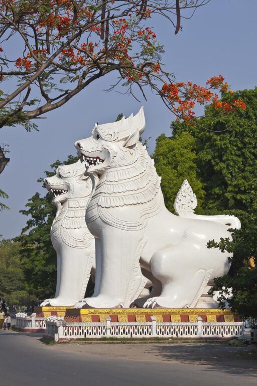 Giant CHINLES (half lion half dragon) guard the southwest entrance to MANDALAY HILL - MANDALAY, MYANMAR