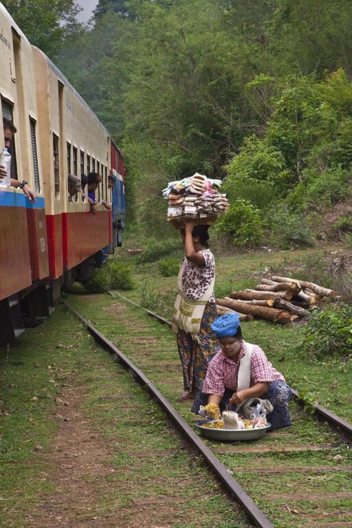 BURMESE vendors sell food to passengers on the train ride from Pyin U Lwin to Hsipaw - MYANMAR