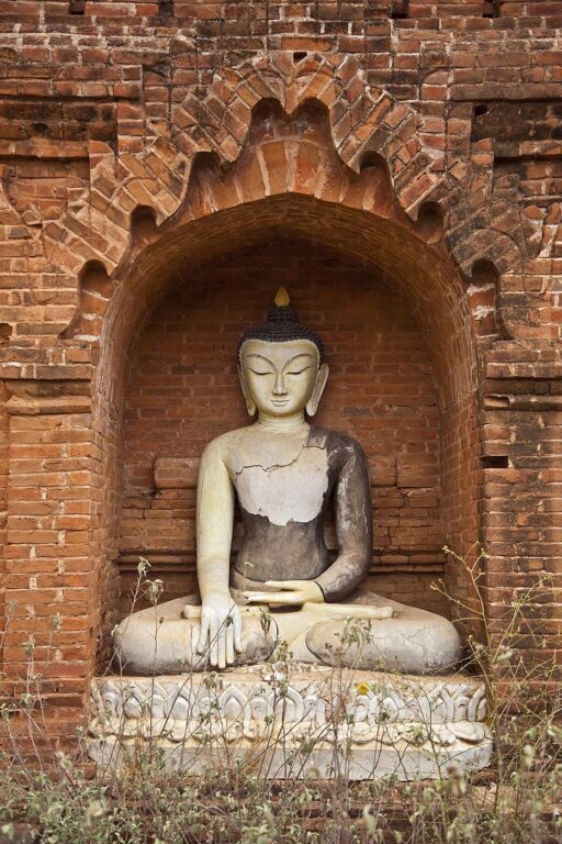 The rarely visited LAW KAHTIKEPAN temple complex has a lovely BHUDDA STATUE in an exterior niche - BAGAN, MYANMAR