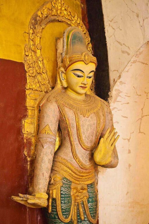 A Buddhist deity at ANANDA PAYA or TEMPLE which was built by King Kyanzittha around 1100 - BAGAN, MYANMAR