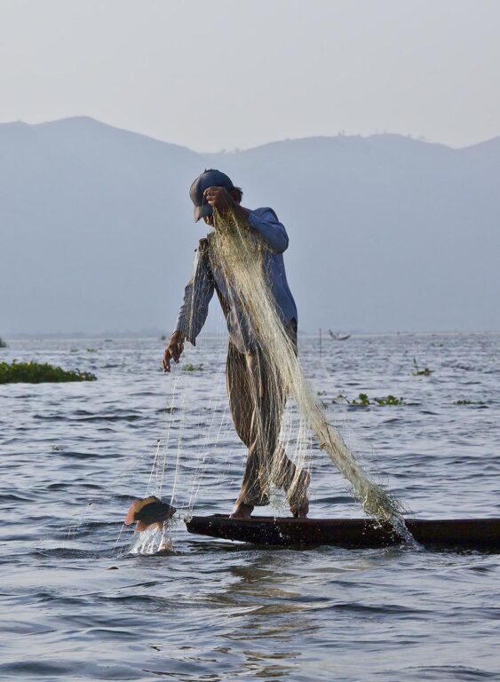 Fishing is still done in the traditional way with small wooden boats and fishing nets - INLE LAKE, MYANMAR