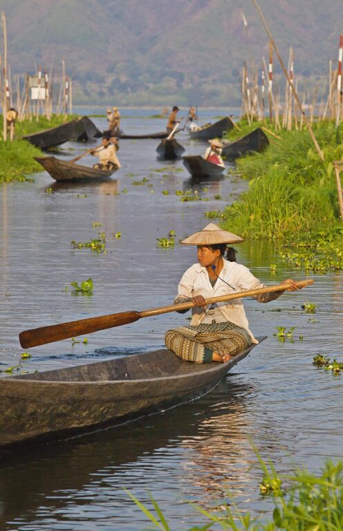 Hand made WOODEN BOATS are the main form of transportation on INLE LAKE - MYANMAR