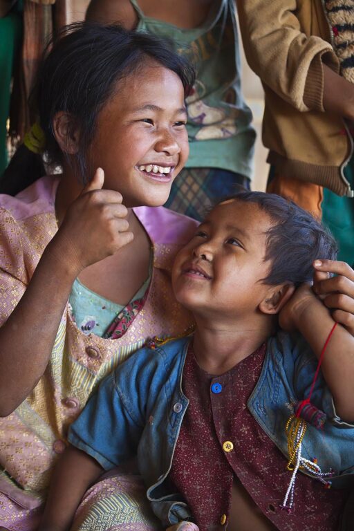 ANN TRIBAL CHILDREN laughing in a village near KENGTUNG or KYAINGTONG - MYANMAR