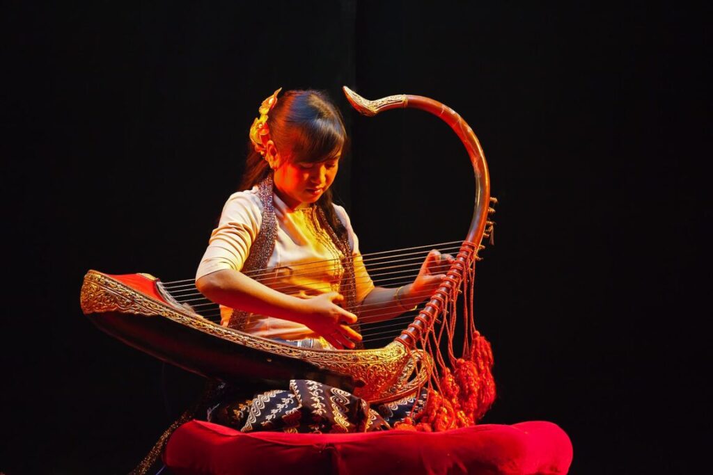 Traditional HARP MUSIC is performed at the MANDALAY MARIONETTES THEATER - MANDALAY, MYANMAR