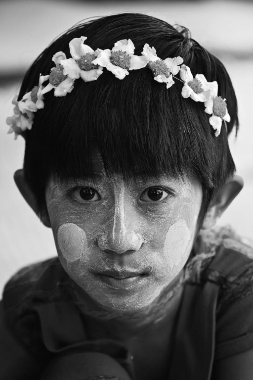 A BURMESE GIRL with skin lightening cream on the Island of INWA which served as the Burmese Kingdoms capitol for 400 years - MYANMAR