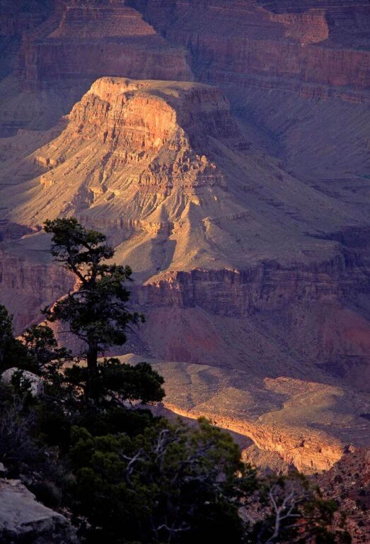 Late afternoon sunlight dances among the rock formations of the GRAND CANYON NATIONAL PARK as seen from the South Rim - ARIZON