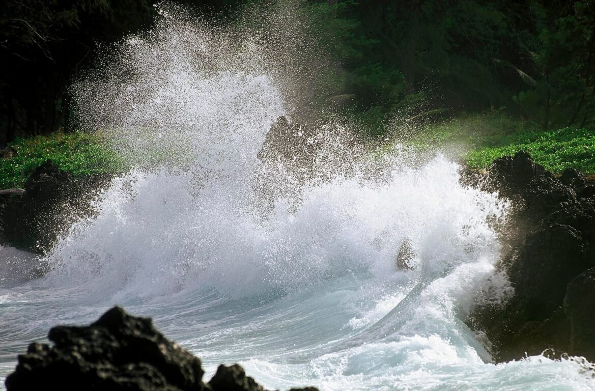 PACIFIC WAVES meets the Hawaiian shore at KEANEA POINT and village on the road to HANA - MAUI, HAWAII