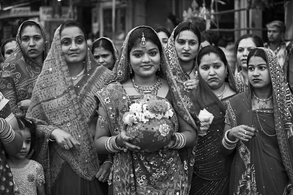 Rajasthani women carry a clay pot through the city as part of the GANGUR FESTIVAL in JOHDPUR - RAJASTHAN, INDIA