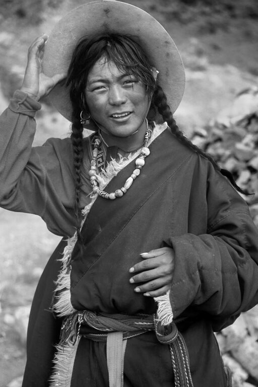 FEMALE TIBETAN PILGRIM doing KORA around MOUNT KAILASH, a BUDDHIST & HINDU sacred site in the TIBET HIMALAYA