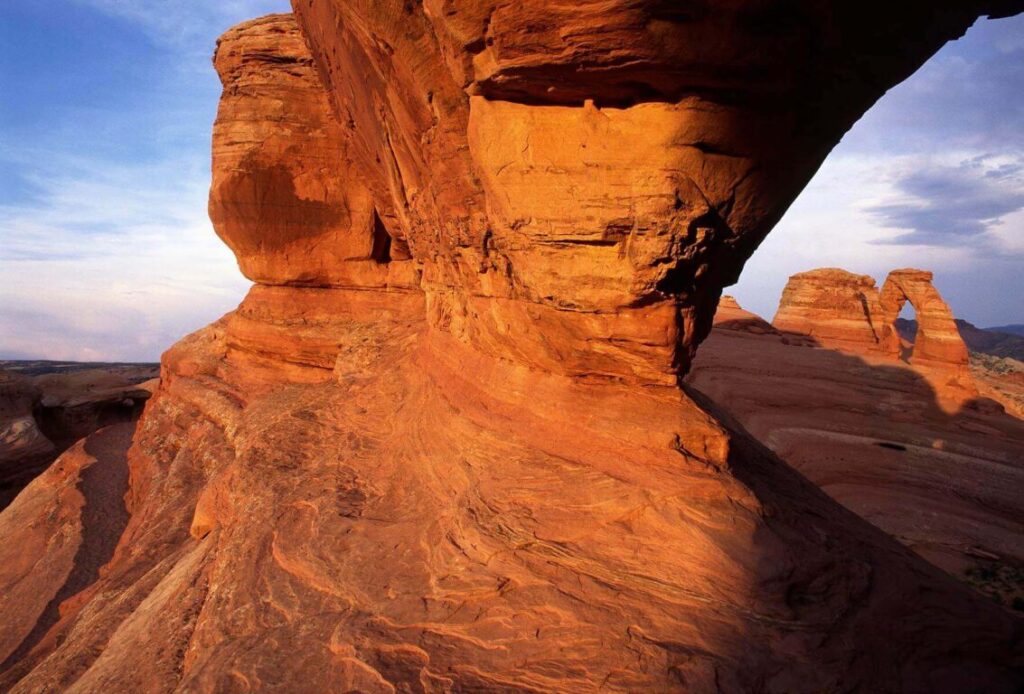 DELICATE ARCH as seen through a nearby widow in ARCHES NATIONAL PARK - UTAH