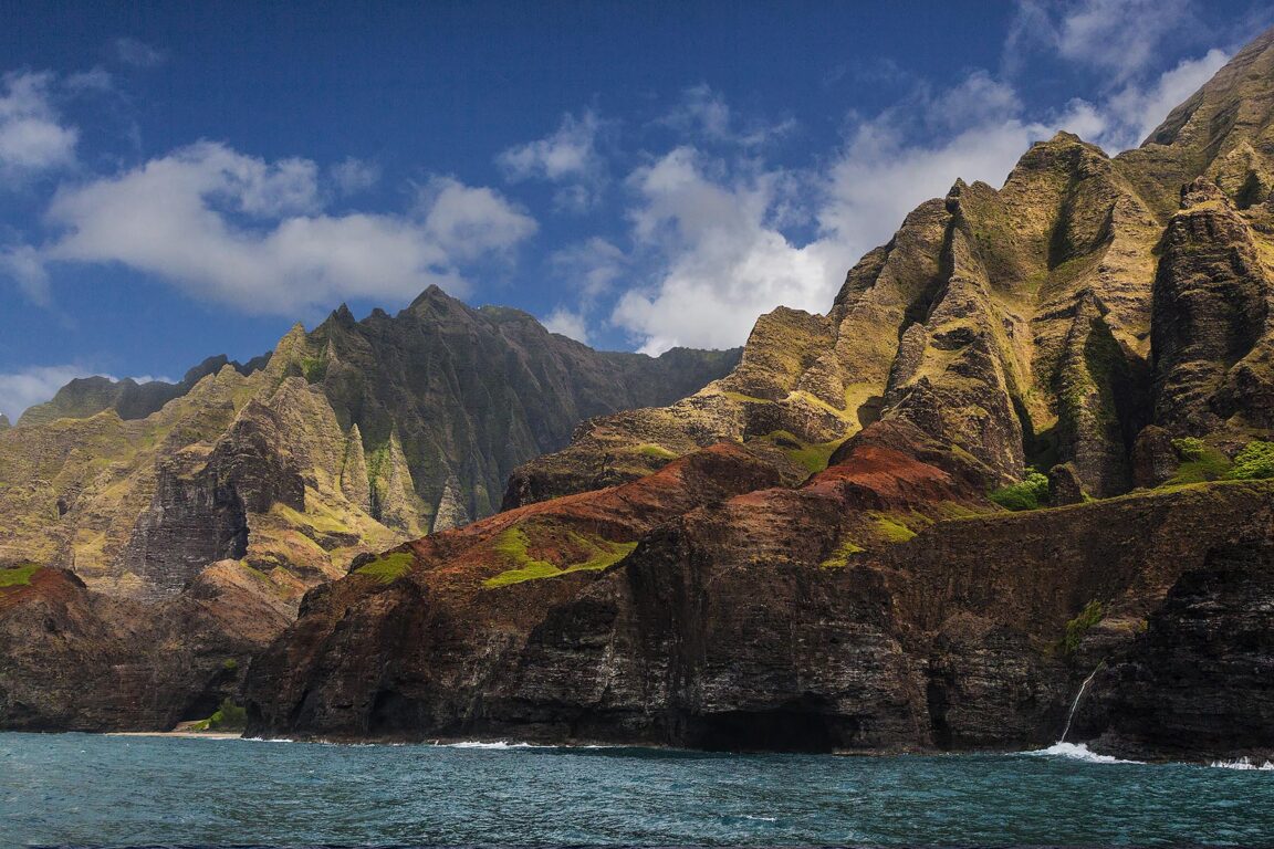 Dramatic lava formations drop into the Pacific ocean along the NA PALI COAST - KAUAI, HAWAII
